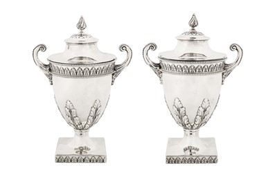 Lot 324 - A pair of George V sterling silver condiment vases, London 1913 by Charles Stuart Harris