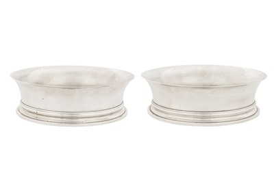 Lot 300 - A pair of Elizabeth II sterling silver wine coasters, London 1974 by Comyns