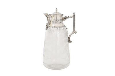 Lot 366 - A Victorian sterling silver mounted glass claret jug, London 1873 by Martin, Hall and Co