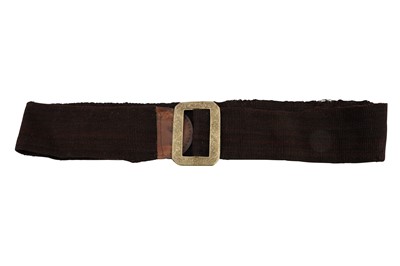 Lot 34 - A BROWN-DYED COARSE WOOL BELT WITH AN ENGRAVED WHITE METAL BELT BUCKLE