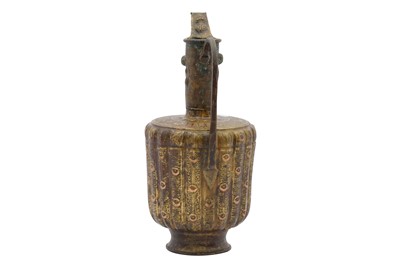 Lot 9 - A COPPER-INLAID BRASS EWER WITH LION AND LUNAR MOTIFS