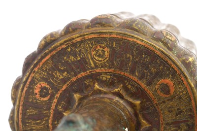 Lot 9 - A COPPER-INLAID BRASS EWER WITH LION AND LUNAR MOTIFS