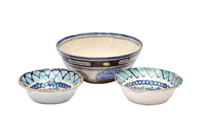 Lot 246 - THREE IRANIAN POTTERY BOWLS WITH FLORAL MOTIFS