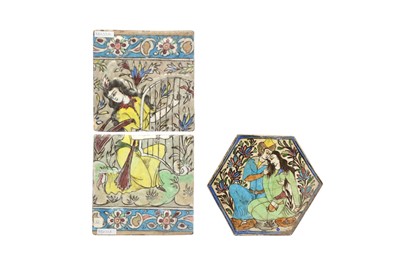 Lot 230 - THREE QAJAR-REVIVAL POTTERY TILES WITH ROMANTIC FIGURES