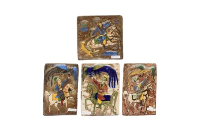 Lot 228 - FOUR QAJAR-REVIVAL MOULDED POTTERY TILES WITH RIDERS ON THEIR STEEDS