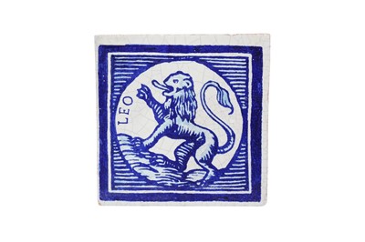 Lot 554 - A EUROPEAN BLUE AND WHITE CERAMIC TILE WITH A QUASI-RAMPANT LION