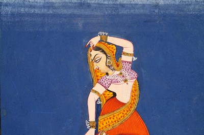 Lot 163 - A NAYIKA PLUCKING A THORN FROM HER FOOT