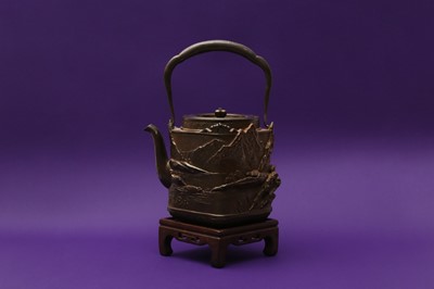 Lot 1008 - A JAPANESE IRON 'LANDSCAPE' TEA KETTLE AND COVER, TETSUBIN BY OKUNI