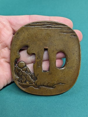Lot 1019 - A JAPANESE BRONZE 'HOTEI' SWORD GUARD, TSUBA BY HAMANO SHOZUI (1696 – 1769)