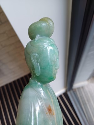 Lot 185 - A CHINESE JADE CARVING OF GUANYIN