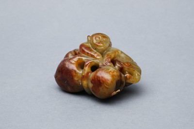 Lot 513 - A CHINESE RUSSET JADE 'MONKEY AND PEACH' GROUP