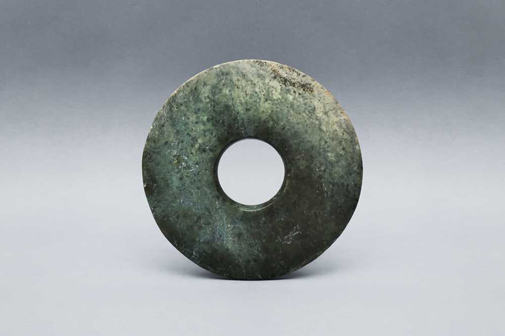 Lot 361 - A CHINESE ARCHAIC GREEN JADE DISC, BI