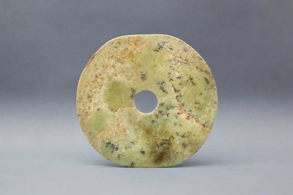 Lot 322 - A LARGE CHINESE ARCHAIC GREEN JADE DISC, BI