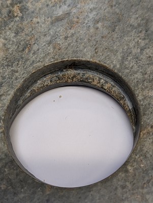 Lot 374 - A LARGE CHINESE ARCHAIC MOTTLED GREEN JADE DISC, BI