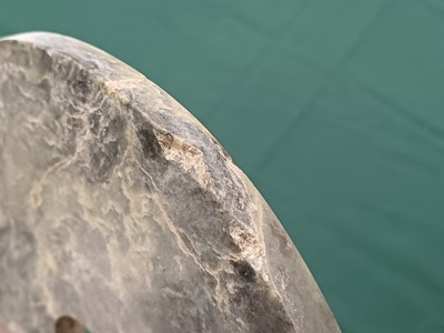 Lot 373 - A LARGE CHINESE ARCHAIC MOTTLED GREEN JADE DISC, BI