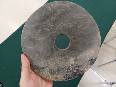 Lot 373 - A LARGE CHINESE ARCHAIC MOTTLED GREEN JADE DISC, BI