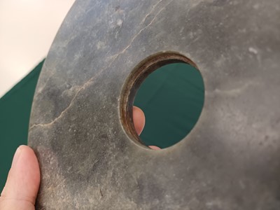 Lot 373 - A LARGE CHINESE ARCHAIC MOTTLED GREEN JADE DISC, BI