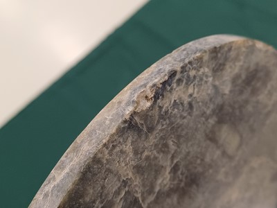 Lot 373 - A LARGE CHINESE ARCHAIC MOTTLED GREEN JADE DISC, BI