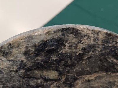 Lot 373 - A LARGE CHINESE ARCHAIC MOTTLED GREEN JADE DISC, BI