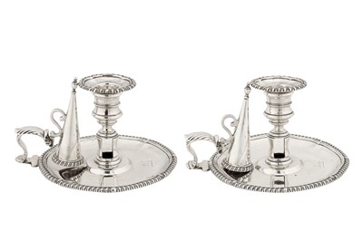 Lot 381 - A pair of early Victorian sterling silver chambersticks, London 1837 by Robert Garrard II (reg. 16th April 1818)