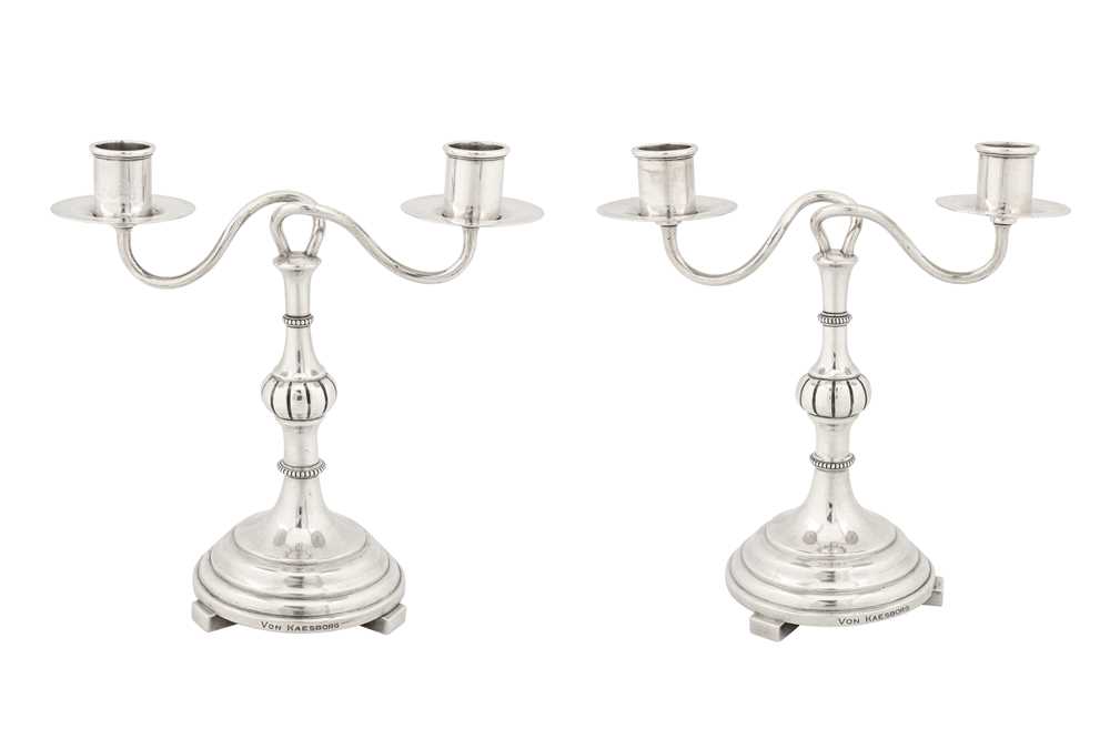 Lot 192 - A pair of early 20th century Latvian 84 zolotnik silver twin candelabra, Riga 1908-26 by Hermann Bank