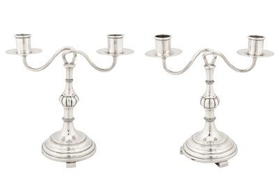 Lot 192 - A pair of early 20th century Latvian 84 zolotnik silver twin candelabra, Riga 1908-26 by Hermann Bank