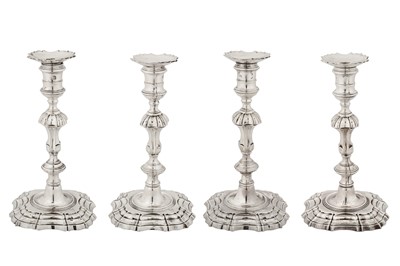 Lot 455 - A set of four George II sterling silver candlesticks, London 1750 by William Gould