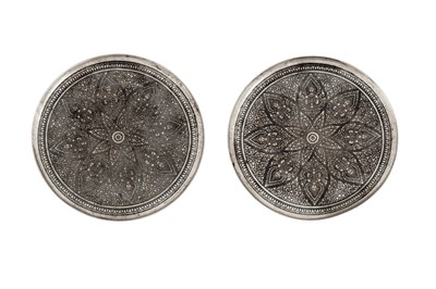 Lot 171 - A pair of early 20th century Siamese (Thai) silver and niello dishes or coasters, Bangkok circa 1930 by Sykha