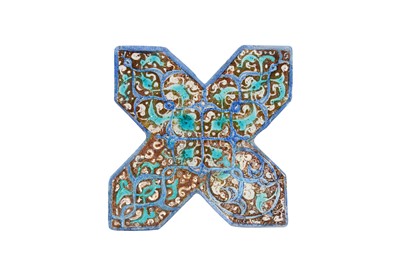 Lot 276 - A COBALT BLUE AND COPPER LUSTRE-PAINTED POTTERY CROSS-SHAPED TILE