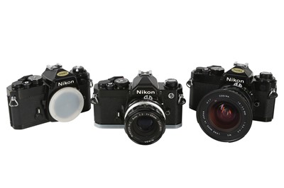 Lot 1042 - Black Nikon FE & FM Cameras.