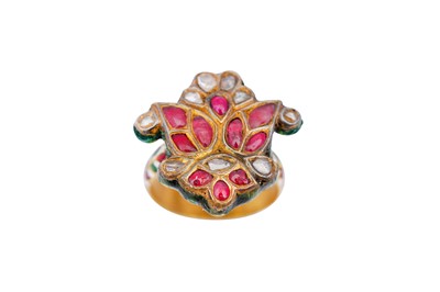 Lot 265 - AN INDIAN POLYCHROME ENAMELLED GEM-SET CHILD'S RING