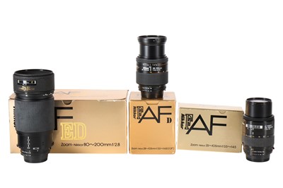 Lot 1302 - A Selection of Three Boxed Nikkor AF lenses.