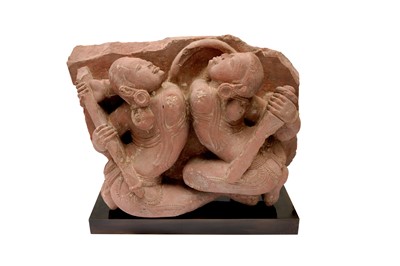 Lot 101 - A CARVED RED SANDSTONE FIGURE OF FEMALE WARRIORS