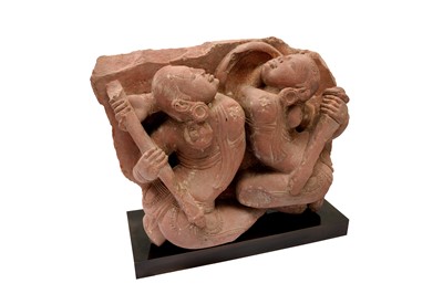 Lot 101 - A CARVED RED SANDSTONE FIGURE OF FEMALE WARRIORS