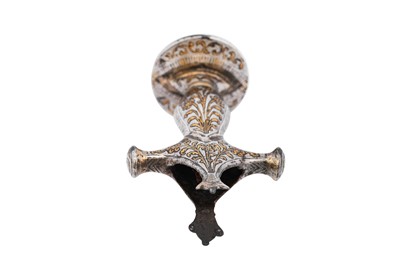 Lot 211 - AN INDIAN SILVER AND GOLD-INLAID (KOFTGARI) STEEL SWORD HILT