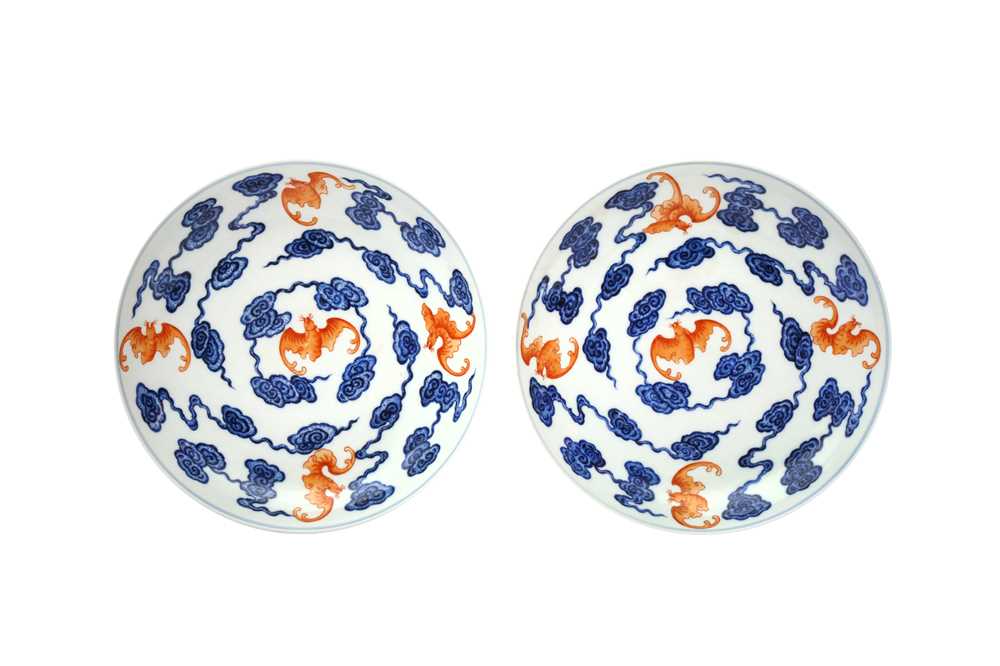 Lot 158 - A PAIR OF CHINESE BLUE AND WHITE AND IRON-RED 'BAT' DISHES