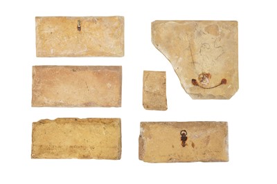 Lot 287 - SIX FRAGMENTS OF SAFAVID CUERDA SECA POTTERY BORDER TILES
