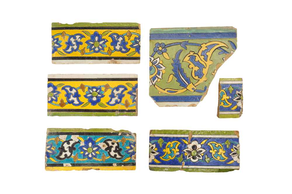 Lot 287 - SIX FRAGMENTS OF SAFAVID CUERDA SECA POTTERY BORDER TILES