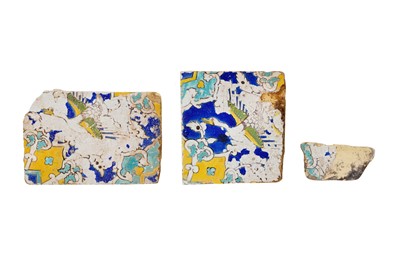 Lot 283 - THREE FRAGMENTS OF SAFAVID CUERDA SECA POTTERY TILES WITH FLYING GEESE