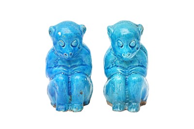 Lot 807 - A PAIR OF CHINESE MONOCHROME BLUE-GLAZED 'MONKEY' FIGURES