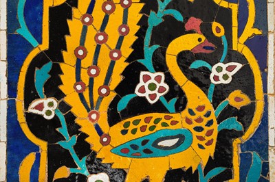 Lot 284 - A TALL SAFAVID POTTERY TILE MOSAIC WITH A YELLOW PEACOCK