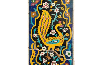 Lot 284 - A TALL SAFAVID POTTERY TILE MOSAIC WITH A YELLOW PEACOCK