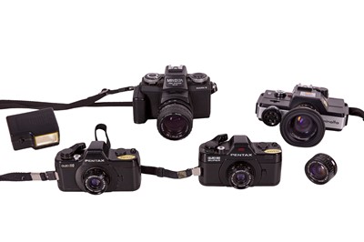 Lot 1398 - A selection of 110  SLR cameras.