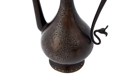 Lot 348 - A QAJAR GOLD-DAMASCENED STEEL EWER