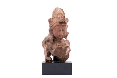 Lot 100 - A FRAGMENTARY CARVED RED SANDSTONE STATUE OF LORD SHIVA