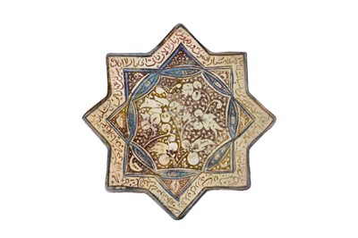 Lot 278 - A COBALT BLUE AND COPPER LUSTRE-PAINTED POTTERY STAR TILE