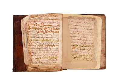 Lot 383 - TWO MAGHRIBI MANUSCRIPTS: MUHAMMAD AL-JAZULI (D.1472)'S DALA’IL AL-KHAYRAT