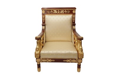 Lot 101 - A FRENCH EMPIRE STYLE PARCEL GILT MAHOGANY ARMCHAIR