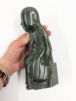 Lot 184 - A CHINESE SPINACH-GREEN JADE FIGURE OF AN IMMORTAL