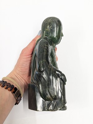 Lot 184 - A CHINESE SPINACH-GREEN JADE FIGURE OF AN IMMORTAL